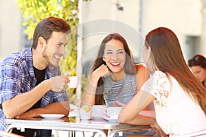 Friends talking in a coffee shop terrace