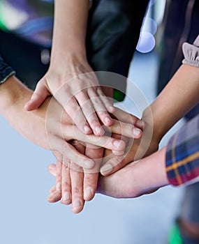 Friends till the end. a group of unidentifiable friends making a pact by putting their hands in a pile.