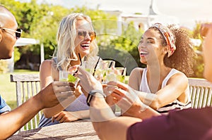 Friends toasting with cocktails