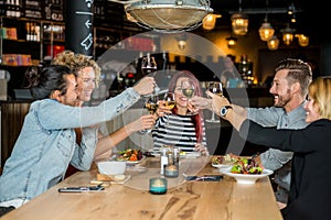 Friends Toasting Wineglasses At Restaurant