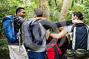 Friends Trekking in a forest