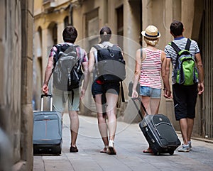 Friends at vacation walking at the street