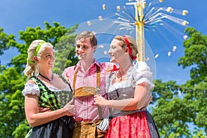 Friends visiting Bavarian folk festival