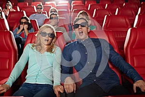 Friends watching horror movie in 3d theater