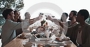 Friends, wine glass and cheers for holiday celebration, Christmas lunch or success at dining room table. Happy people