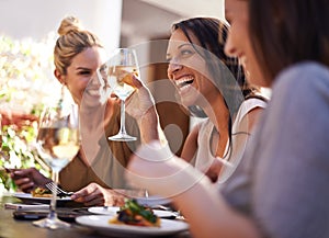 Friends, wine and women laughing at restaurant with drinking, bonding and relax outdoor in city for celebration. People