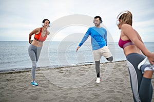 Friends worming up for a training on the beach