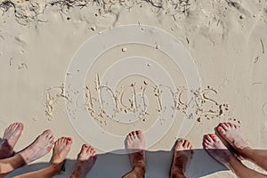 Friendship Etched in Sand: Vacationers inscribe 'Bahamas' on Great Stirrup Cay's Shore