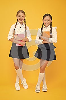 Friendship goals. Cute school girls with books. First day at school. Most important thing one learns in school is self