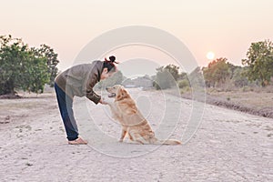 Friendship between human and dog - shaking hand and paw