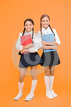 friendship. kids learning grammar. back to school. dictionary notebook. Get information. little girls in school uniform