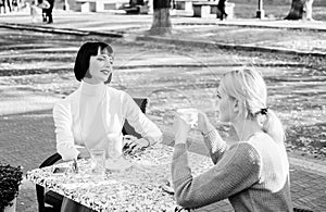 Friendship meeting. Female friendship. Trustful communication. Girls friends drink coffee and talk. Conversation of two