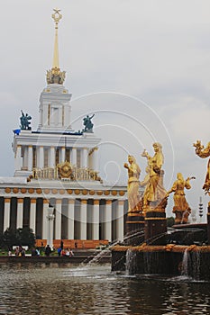 The Friendship of Peoples Fountain in Moscow at VDNH. Soviet architecture of the Stalinist period, gilded sculptures, water flows