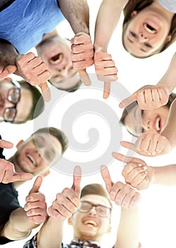 Friendship, youth and people concept - group of smiling teenagers with hands on top each other photo