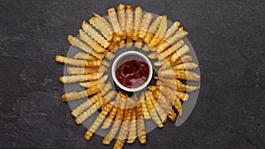 Fries gather around ketchup recipient then disappear along with the delicious sauce