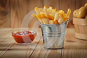 Fries Of Potato In Stilised Metalick Bucket Ketchup And Whole Potato