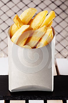 Fries slices in a box fast food, country potatoes