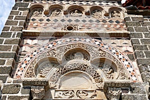 Frieze and Tympanum sculpted above the entrance to the Saint-Michel chapel at the top of the Aiguilhe rock near Le Puy-en-Velay