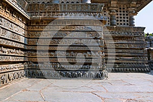 Friezes of animals, scenes from mythological episodes at the base of temple, Hoysaleshwara temple, Halebidu, Karnataka. View from photo