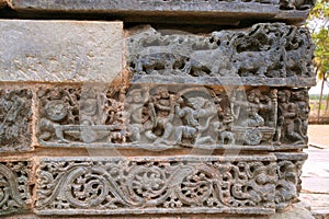Friezes at the base of temple. Kedareshwara temple, Halebidu, Karnataka, India photo