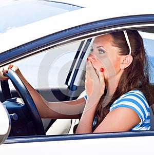 Fright face of woman in the car.