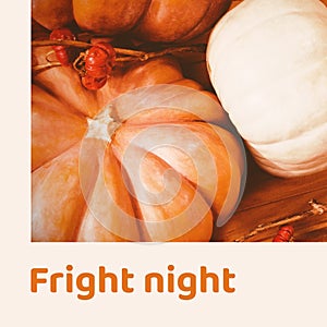 Fright night text in orange and halloween pumpkins on wood