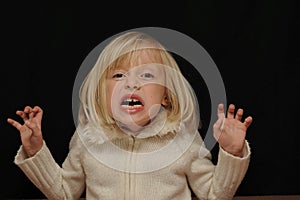 Frightened blond girl photo