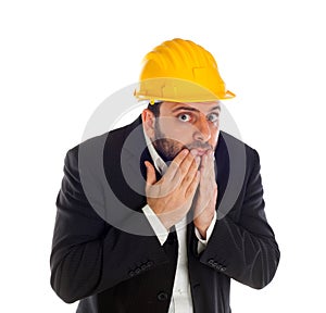 Frightened businessman with construction helmet