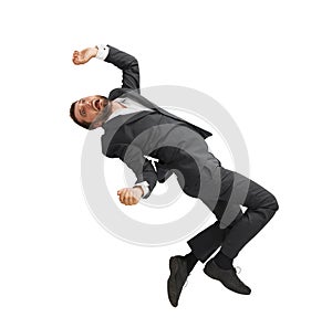 Frightened businessman falling down