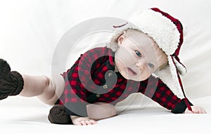 Frightened Christmas baby falling over