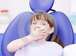 Frightened girl at dentists office