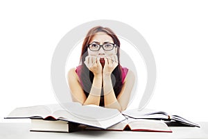 Frightened girl with textbooks