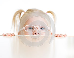 Frightened kid or child in eyeglasses playing
