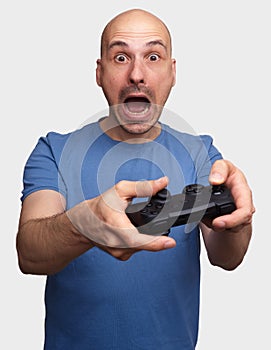 Frightened middle aged man playing video game