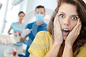 Frightened patient at dentist`s surgery