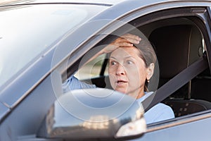 Frightened woman in car.