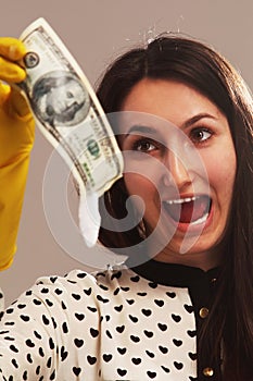 Frightened woman launder shady money (illegal cash, dollars bill