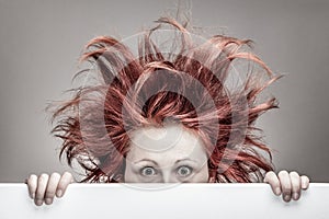 Frightened woman with messy hair