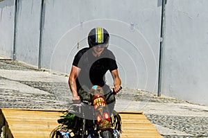 FRIGILIANA, SPAIN - MAY 13, 2018 `Autos Locos` - traditional fun involving the ride of cardboard cars in small spanish town