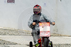 FRIGILIANA, SPAIN - MAY 13, 2018 `Autos Locos` - traditional fun involving the ride of cardboard cars in small spanish town