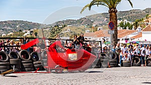 FRIGILIANA, SPAIN - MAY 13, 2018 `Autos Locos` - traditional fun involving the ride of cardboard cars in small spanish town