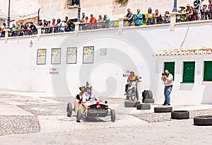 FRIGILIANA, SPAIN - MAY 13, 2018 `Autos Locos` - traditional fun involving the ride of cardboard cars in small spanish town