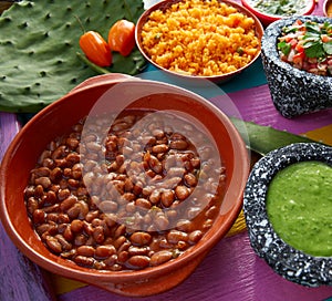 Frijoles mexican beans with rice and sauces