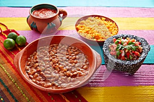 Frijoles mexican beans with rice and sauces