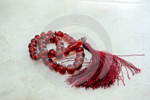 A fringed red rosary