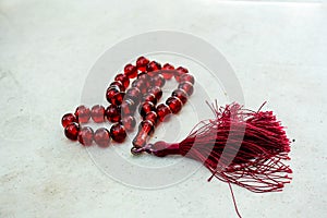 A fringed red rosary