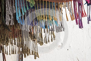 Fringes on colorful textiles on sale in a Moroccan Market