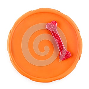 Frisbee disc and chewing bone isolated on a white background