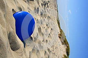 Frisbee in sand