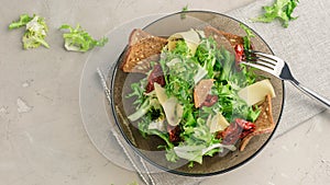 Frisee lettuce salad with sun dried tomatoes